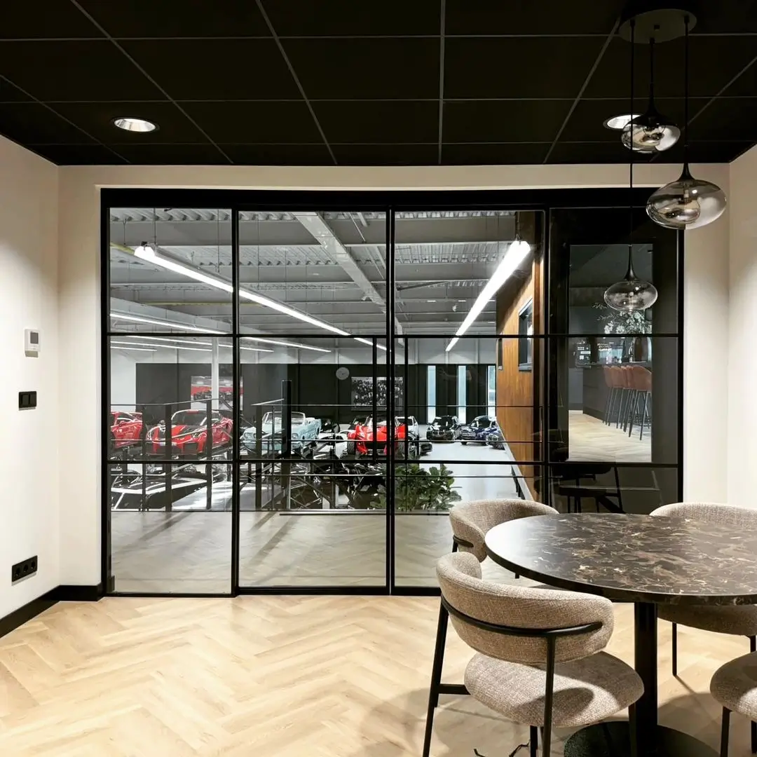 aluminium French doors leading to a car gallery